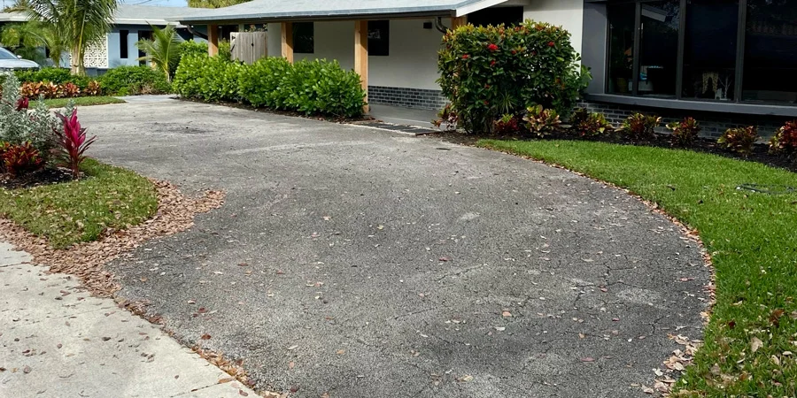 Worn and faded asphalt driveway