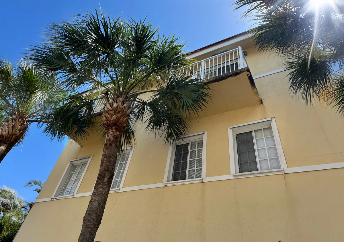 Building exterior with dirt and mildew stains